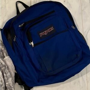 Jansport backpack. Lots of zippered pockets.  Great for school!  Only Blue one